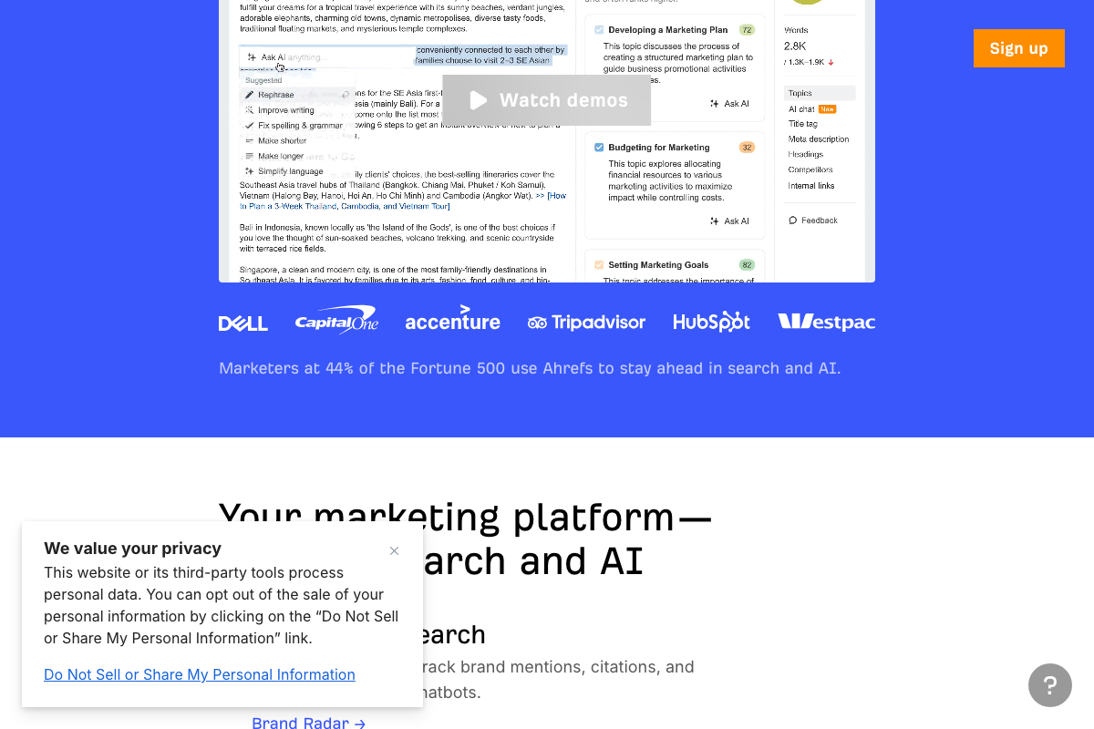 Ahrefs homepage mid-scroll showing product demo features including content scoring and Brand Radar.