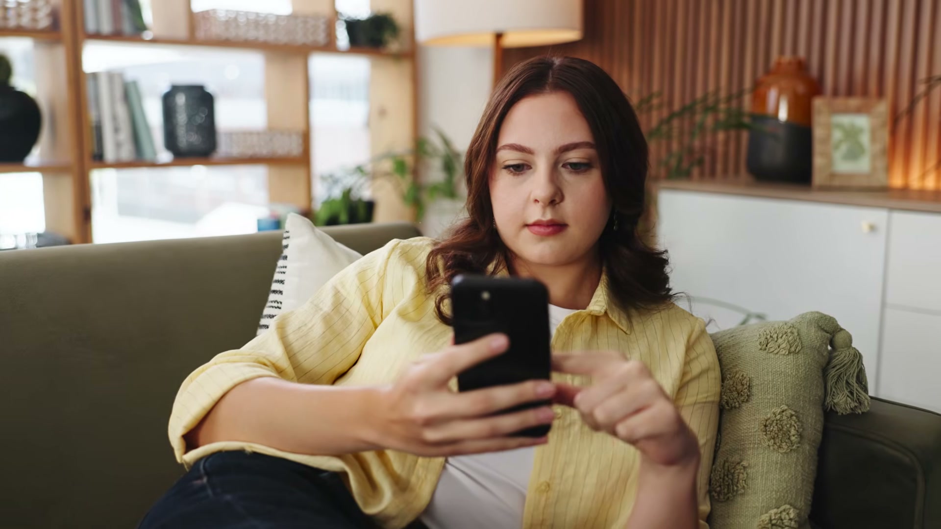 Short-form video is consumed in exactly this posture — your content has seconds to change that thumb's direction.