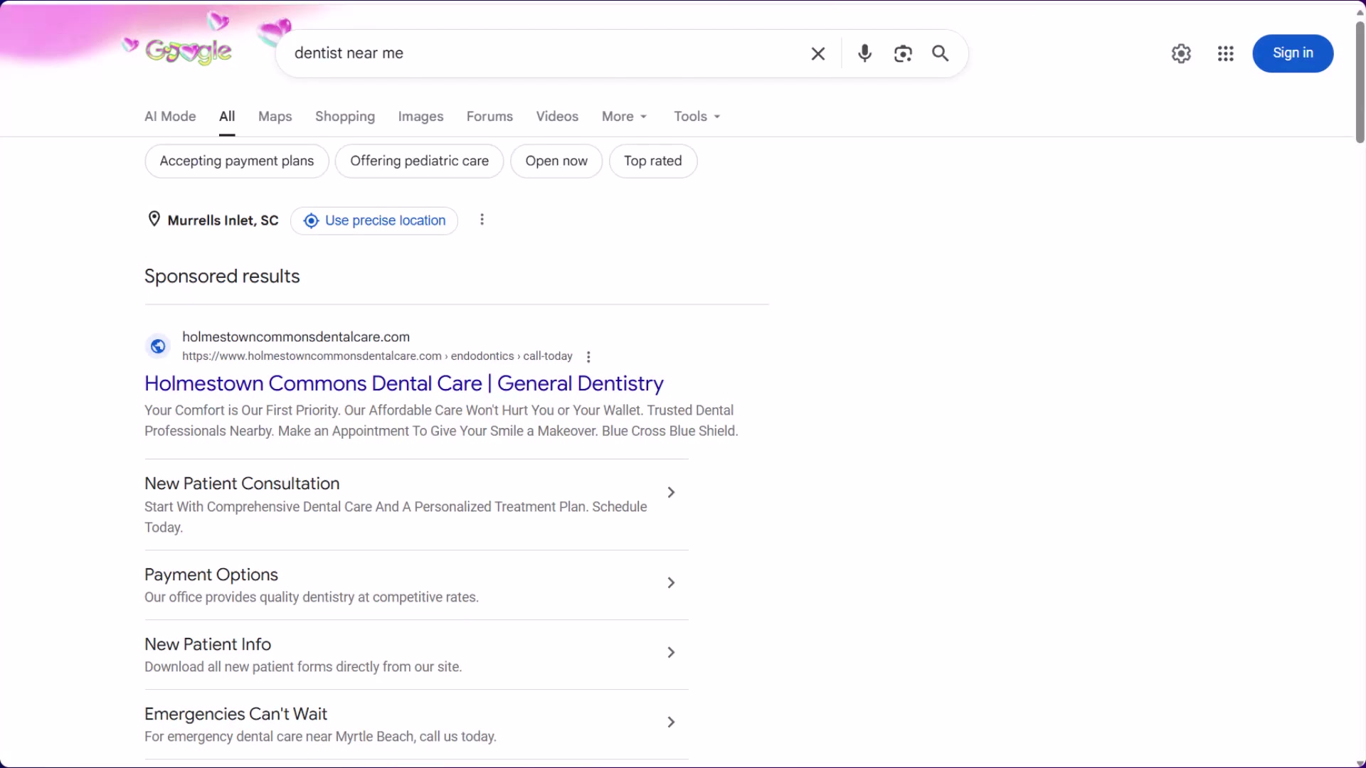 A 'dentist near me' search surfaces paid ads with sitelink extensions first — practices running Google Ads for emergency, new patient, and payment keywords dominate this position.