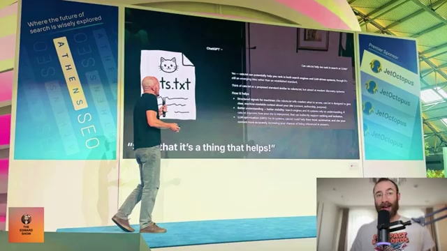 On stage at Athens SEO, Williams-Cook shows ChatGPT's own words: it called cats.txt 'a thing that helps' for search and LLM discovery.