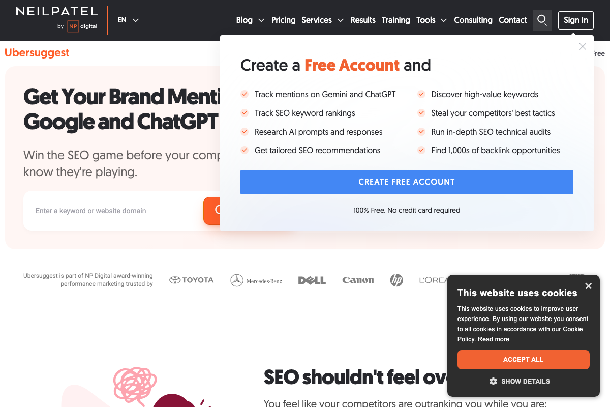 Ubersuggest homepage showing the free account sign-up modal; AI mention tracking covers Gemini and ChatGPT specifically, and the entry field accepts keywords or domains.