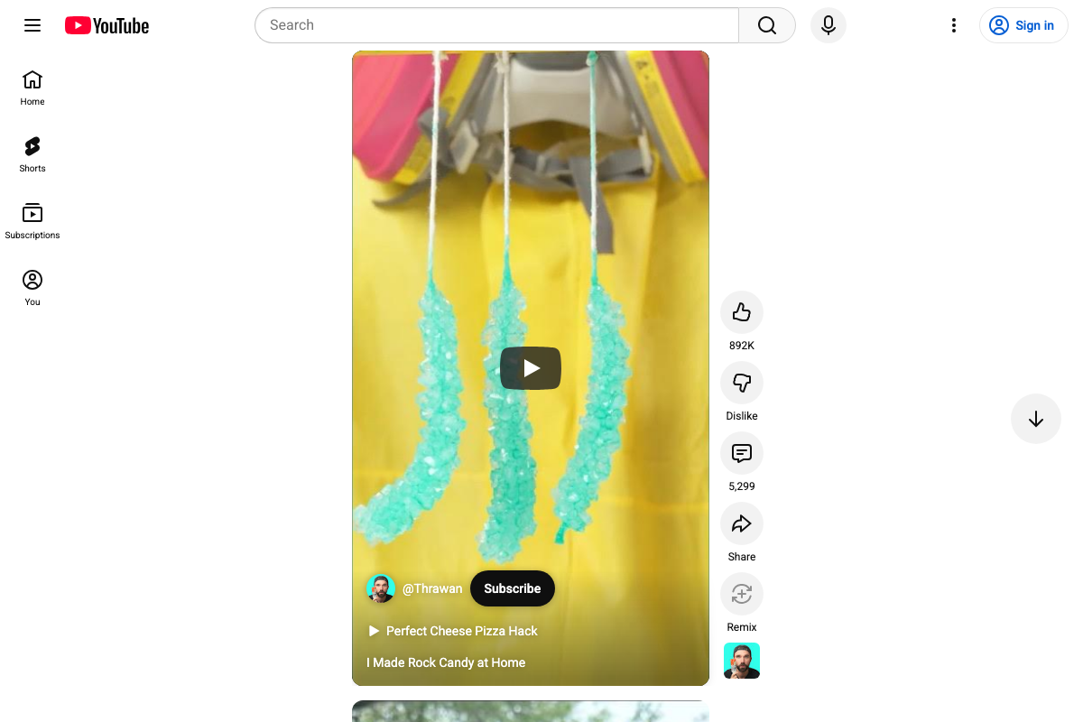 YouTube Shorts viewer confirming the Remix button with circular-arrow icon and a visible remixer avatar — 892K likes and 5,299 comments on 